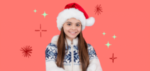 a girl with christmas hat on an orange background