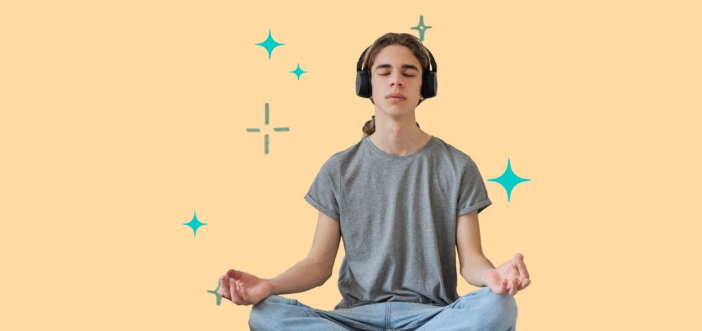 meditating boy with headphones on an orange background