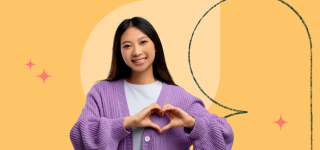 A girl holds her hands in the shape of a heart illustrating the definition of SEL